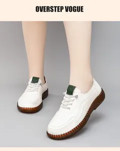 Detail of white leather casual loafers with contrast hand-stitched seams and gum sole