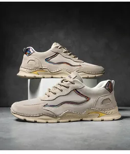 Detailed macro view of men's casual hiking shoe featuring khaki suede and mesh textures