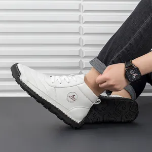 Detailed view of white leather boot upper with black anti-slip rubber outsole