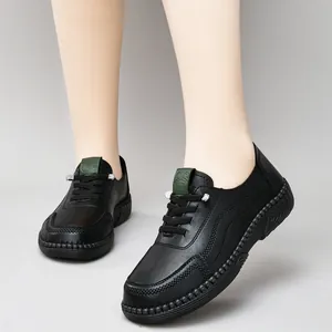 Women's black leather casual flat shoes with thick non-slip soles and green tongue label