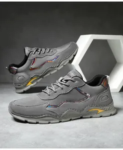 Detail view of grey hiking shoes with laser stripes and yellow modular thick sole design
