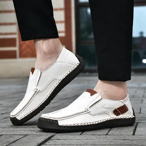 White leather loafers for men with brown trim and anti-slip rubber sole for casual wear