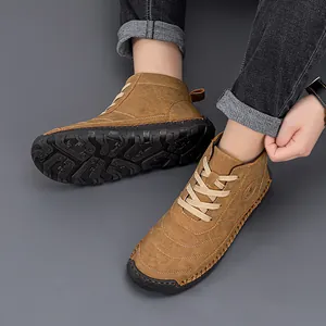 Close-up of brown work boots featuring non-slip rubber soles and durable laces