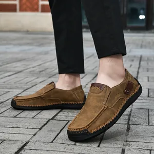 Close-up of brown suede loafers featuring hand-stitched seams and Fashion Outdoor sole detail