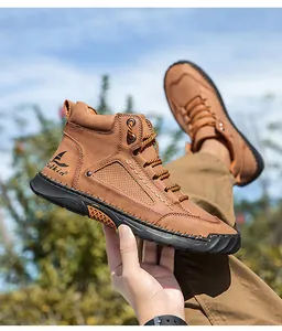 Detail of tan PU leather boot featuring breathable perforations and a durable rubber sole