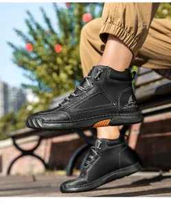 Detail of black leather lace-up boots with reinforced stitching and Salkin branding
