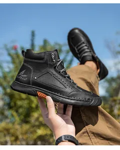 Detail of high-top men's PU leather boot with litchi grain texture and rubber sole