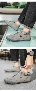 Detail view of grey high-top casual boots with durable sole and logo branding
