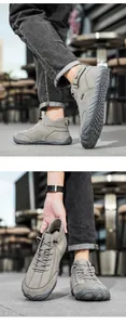 Detailed view of men's high-top outdoor boots with velcro strap and non-slip rubber sole