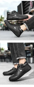 Close-up of black leather mid-top shoes with LDECK logo, velcro strap and rubber sole