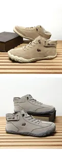 Detail view of khaki and grey outdoor high-top suede boots with anti-slip rubber soles