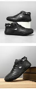 Detail of black leather high-top boots featuring velcro straps and anti-collision rubber toes