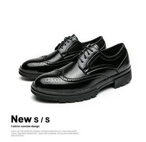 Detailed close-up of black Brogue carving and non-slip rubber sole on formal dress shoes