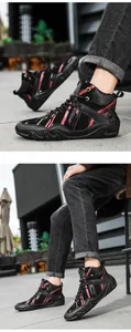 Close-up of men's high-top sneakers featuring red stripes and durable non-slip rubber soles