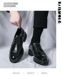 Detailed close-up of British style brogue carving on men's black leather formal shoes