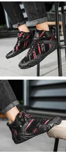 Detail of high-top casual boots with red hand-painted stripes and wavy grip sole