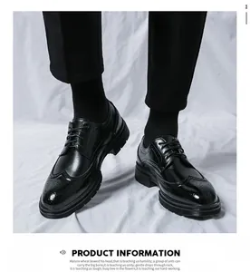Detail of men's black leather brogue shoes with wingtip perforations and classic lacing