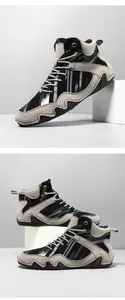 Detail view of high-top casual boots with black and grey color blocking and wavy rubber sole