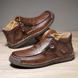 Botas de cuero granulado marrón oscuro para hombre con cremallera y suela de goma