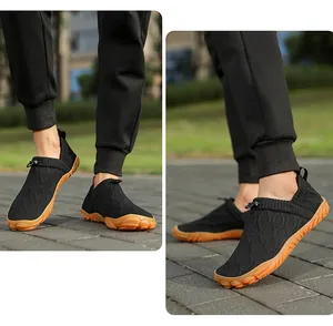 Detail view of khaki wading shoes with mesh knit texture and adjustable toggle closure