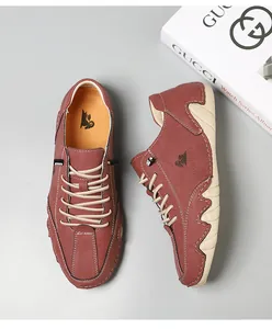 Top-down view of men's reddish-brown suede casual shoes with thick beige rubber soles