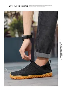 Outdoor close-up of breathable black knit water shoes with non-slip gum rubber sole