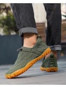 Close-up of breathable olive green knit barefoot shoes with elastic toggles for outdoors