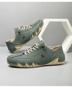 Detail shot of teal nubuck casual shoes with ram logo and contrast stitching