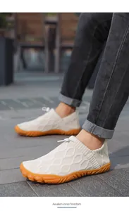 Close-up of camel breathable water shoes with orange non-slip rubber sole and drawstring