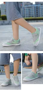 Detail of kids grey sneakers with green mesh, velcro strap, and anti-slip rubber sole