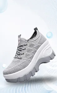 Detail showing grey breathable mesh fabric and heart design on white platform sole