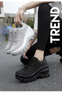 Outdoor street view of breathable mesh platform sneakers in grey and black colors