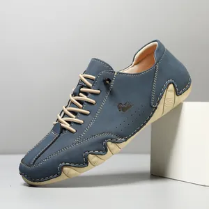 Men's low-top casual shoes in navy blue suede with unique wavy beige soles