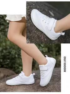 Detail of white barefoot kids shoes with breathable mesh and anti-slip rubber sole