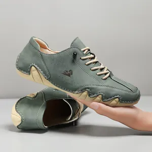 Men's casual dark green low-top leather shoes with wavy soles and beige laces