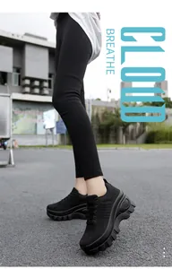 Detail of breathable knit mesh and chunky non-slip rubber sole on black platform sneakers