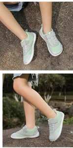 Close-up of grey and green kids barefoot sneakers with breathable mesh and velcro straps