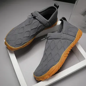Dark grey knitted water shoes with non-slip orange rubber soles and drawstring closure