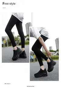 Detail of black platform sneakers with breathable mesh and chunky gear outsole for women