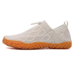 Breathable cream knit wading shoes with anti-slip orange rubber soles and toggle drawstring