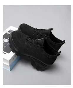 Close-up of black breathable knit sneakers featuring thick rubber soles and mesh fabric