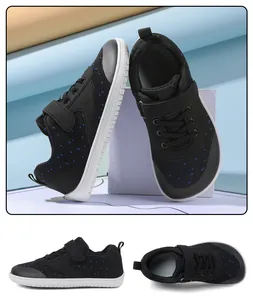 Detail view of black and blue breathable mesh kids' barefoot sneakers with velcro straps