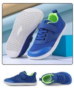 Detail view of breathable navy blue mesh fabric and anti-slip rubber sole of the kids' shoe