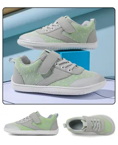 Detail view of breathable kids barefoot sneakers in grey and neon green mesh