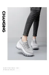 Detail view of grey breathable mesh wedge sneakers with thick anti-slip outsole for women