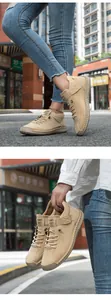 Detail showing hand-stitched sole and lace-up closure on khaki outdoor casual shoes