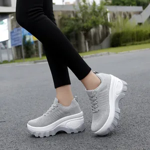 Women's grey breathable mesh platform sneakers with thick soles and lace-up closure