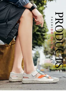 Detail of grey men's sandals with colorful woven straps and chunky rubber sole
