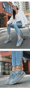 Detail of blue lace-up casual shoes with white stitching and durable rubber sole