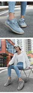 Detail showing hand-stitched blue and grey casual shoes with flexible soft soles